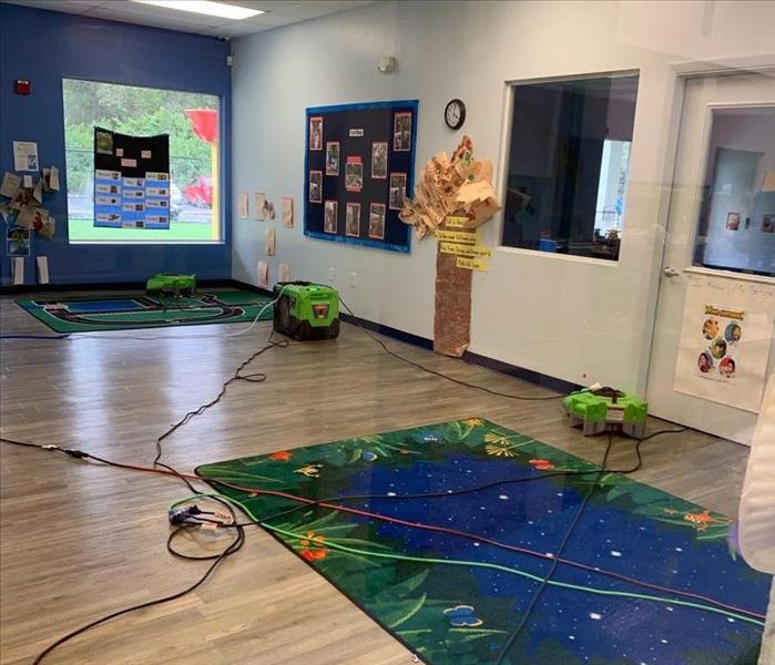 Daycare room with multiple pieces of SERVPRO drying equipment