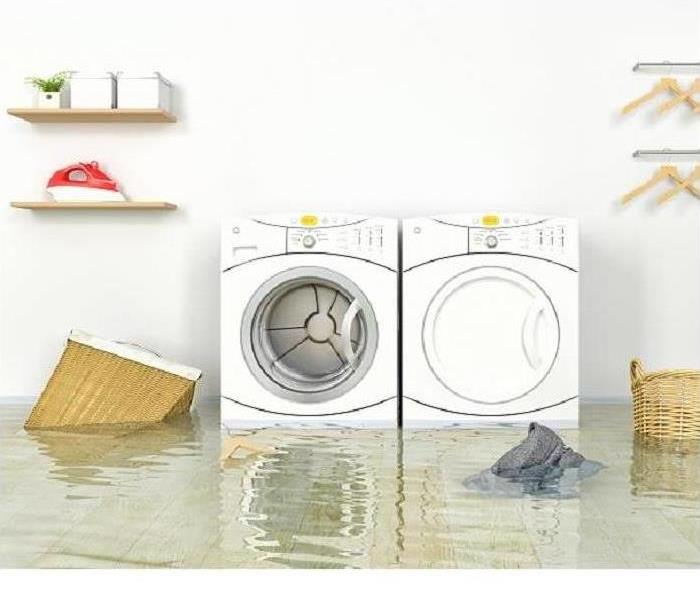 flooded laundry room; pic of washer and drying in standing water