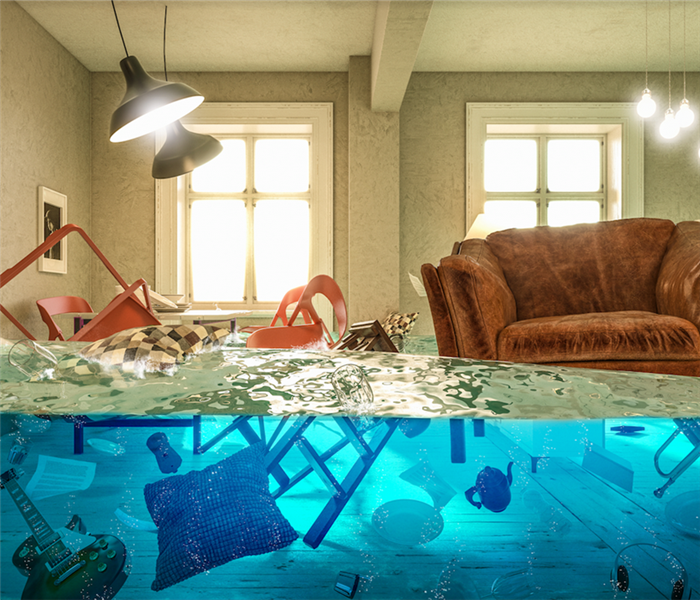 A flooded living room with items floating everywhere