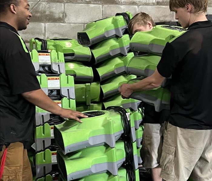 SERVPRO techs load up equiptment for commercial water job