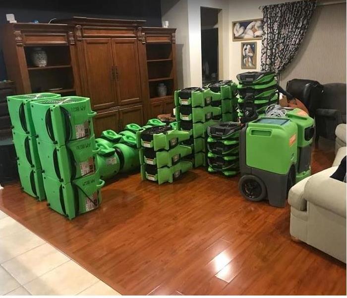 SERVPRO drying equipment stacked in room after completing restoration