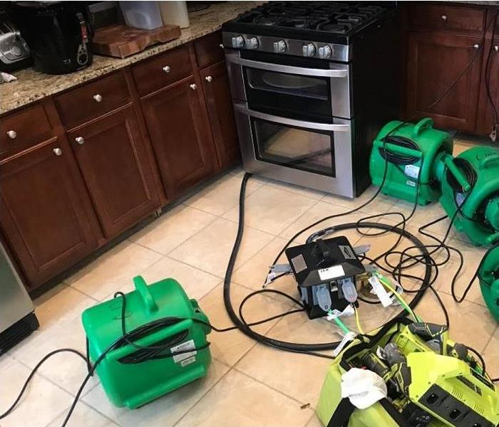 SERVPRO restoration equipment being used to dry kitchen water damage
