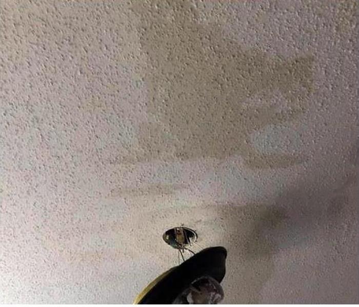 Water stains on a ceiling after a storm