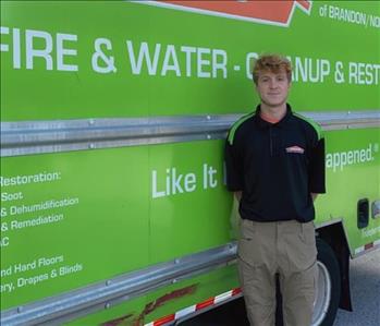 SERVPRO Technician in front of service truck